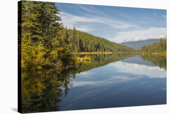 Mountains reflected in a lake along Valley of Five Lakes trail, Jasper National Park, UNESCO World -Jon Reaves-Stretched Canvas