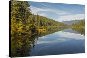 Mountains reflected in a lake along Valley of Five Lakes trail, Jasper National Park, UNESCO World -Jon Reaves-Stretched Canvas