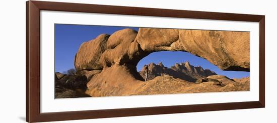 Mountains Viewed Through a Natural Arch with a Mother Holding Her Baby, Spitzkoppe, Namib Desert...-null-Framed Photographic Print