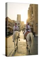 Mounted police on horses, Souq Waqif, Doha, Qatar-Peter Adams-Stretched Canvas