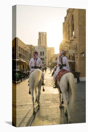 Mounted police on horses, Souq Waqif, Doha, Qatar-Peter Adams-Stretched Canvas