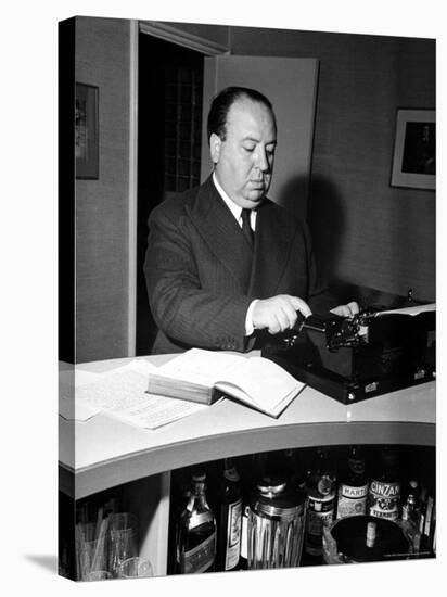 Movie Director Alfred Hitchcock Typing Script on a Portable Typewriter-Peter Stackpole-Stretched Canvas