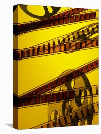 Movie Film and Reel in Yellow Light-null-Stretched Canvas