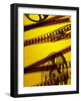 Movie Film and Reel in Yellow Light-null-Framed Photographic Print