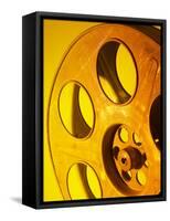 Movie Film and Reels in Yellow Light-null-Framed Stretched Canvas