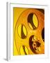 Movie Film and Reels in Yellow Light-null-Framed Photographic Print