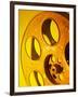 Movie Film and Reels in Yellow Light-null-Framed Photographic Print