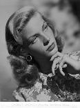 Lauren Bacall posed in Floral Dress with Hand on Chin in Black and White-Movie Star News-Photo