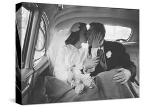 Mr. and Mrs. Thomas Beagan Jr. Kissing in Back of Car after their Wedding Ceremony-Ed Clark-Stretched Canvas