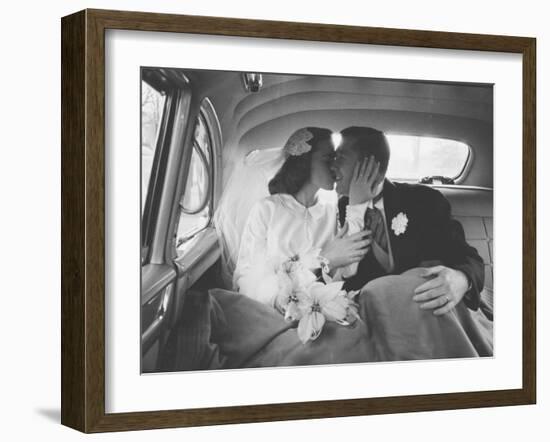 Mr. and Mrs. Thomas Beagan Jr. Kissing in Back of Car after their Wedding Ceremony-Ed Clark-Framed Photographic Print