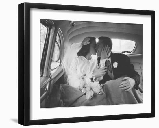 Mr. and Mrs. Thomas Beagan Jr. Kissing in Back of Car after their Wedding Ceremony-Ed Clark-Framed Photographic Print