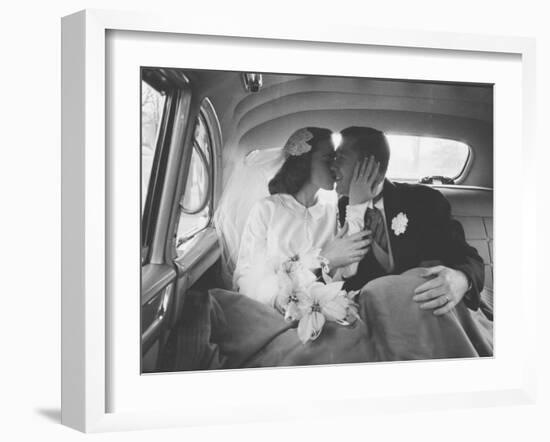 Mr. and Mrs. Thomas Beagan Jr. Kissing in Back of Car after their Wedding Ceremony-Ed Clark-Framed Photographic Print