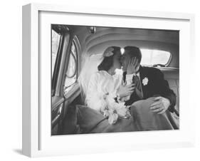 Mr. and Mrs. Thomas Beagan Jr. Kissing in Back of Car after their Wedding Ceremony-Ed Clark-Framed Photographic Print