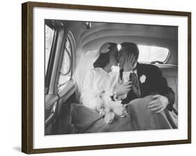 Mr. and Mrs. Thomas Beagan Jr. Kissing in Back of Car after their Wedding Ceremony-Ed Clark-Framed Photographic Print