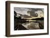 Mrauk U boat jetty at sunset showing waterlogged canoes in the foreground, Rakhine, Myanmar-Brian Graney-Framed Photographic Print