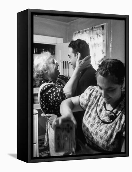 Mrs. Alfonso La Falce Kissing Baby Son at Family Reunion Dinner-Ralph Morse-Framed Stretched Canvas