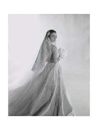 https://imgc.allpostersimages.com/img/posters/mrs-eugene-f-williams-jr-wearing-her-wedding-gown-with-long-train_u-L-PYSDDP0.jpg?artPerspective=n
