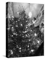 Mrs. George Sutton and Her Family Decorating Their Christmas Tree at Home-Ralph Crane-Stretched Canvas