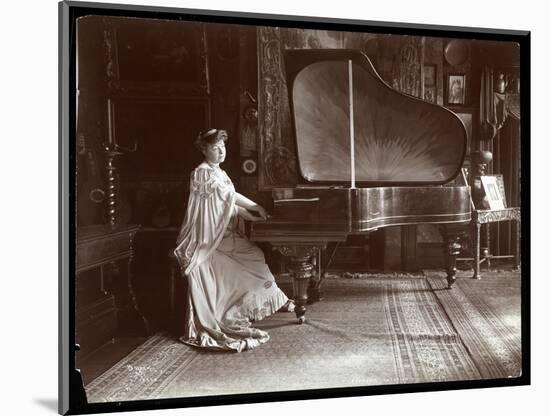 Mrs. I. M. Clark Seated at a Grand Piano, 1904-Byron Company-Mounted Giclee Print