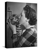 Mrs. Martini, Wife of the Bronx Zoo Lion Keeper, Kissing a Tiger Cub-Alfred Eisenstaedt-Stretched Canvas