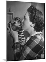 Mrs. Martini, Wife of the Bronx Zoo Lion Keeper, Kissing a Tiger Cub-Alfred Eisenstaedt-Mounted Photographic Print