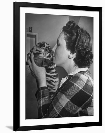Mrs. Martini, Wife of the Bronx Zoo Lion Keeper, Kissing a Tiger Cub-Alfred Eisenstaedt-Framed Photographic Print