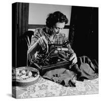 Mrs. Milton D. Phillips Sewing Clothes for Her Family to Stretch the Budget-null-Stretched Canvas