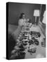 Mrs. Ottilie King Lining Up Her Children's Shoes-Stan Wayman-Stretched Canvas