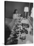 Mrs. Ottilie King Lining Up Her Children's Shoes-Stan Wayman-Stretched Canvas