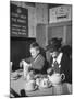 Mrs. Robert Neve and Son Peter Eating Supper in Restaurant-Hans Wild-Mounted Photographic Print