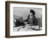 Mrs Teruko Kiyomura, bookkeeper, seated at desk, operating an adding machine while reading a ledger-Ansel Adams-Framed Photographic Print