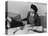 Mrs Teruko Kiyomura, bookkeeper, seated at desk, operating an adding machine while reading a ledger-Ansel Adams-Stretched Canvas