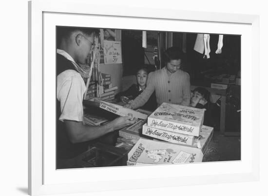 Mrs. Yaeko Nakamura and Family Buying Toys with Fred Moriguchi-Ansel Adams-Framed Premium Giclee Print