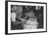 Mrs. Yaeko Nakamura shows her daughters jigsaw puzzles in a store at Manzanar, 1943-Ansel Adams-Framed Photographic Print