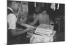 Mrs. Yaeko Nakamura shows her daughters jigsaw puzzles in a store at Manzanar, 1943-Ansel Adams-Mounted Photographic Print