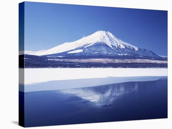 Mt. Fuji reflected in Yamanakako Lake at winter, Yamanashi Prefecture, Japan-null-Stretched Canvas
