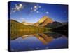 Mt Wilbur Reflects into Fishercap Lake, Many Glacier Valley of Glacier National Park, Montana, USA-Chuck Haney-Stretched Canvas