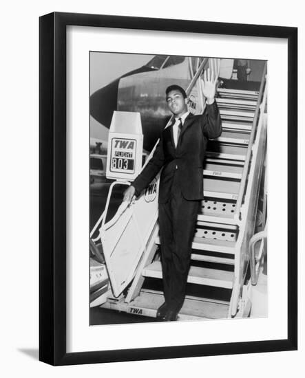 Muhammad Ali, Waves from the Steps of a TWA Airplane at JFK Airport, NYC, 1964-null-Framed Photo