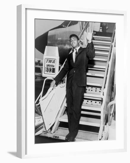 Muhammad Ali, Waves from the Steps of a TWA Airplane at JFK Airport, NYC, 1964-null-Framed Photo