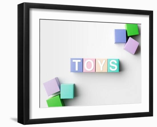 Multicolored Blocks with Toys Word Written on Them, on White. Copy Space Available-Abstract Oil Work-Framed Photographic Print