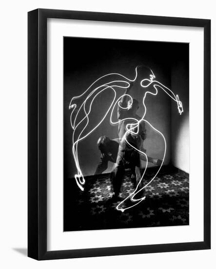 Multiple Exposure of Artist Pablo Picasso Using Flashlight to Make Light Drawing of a Figure-Gjon Mili-Framed Premium Photographic Print