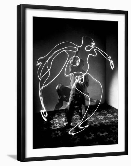 Multiple Exposure of Artist Pablo Picasso Using Flashlight to Make Light Drawing of a Figure-Gjon Mili-Framed Premium Photographic Print