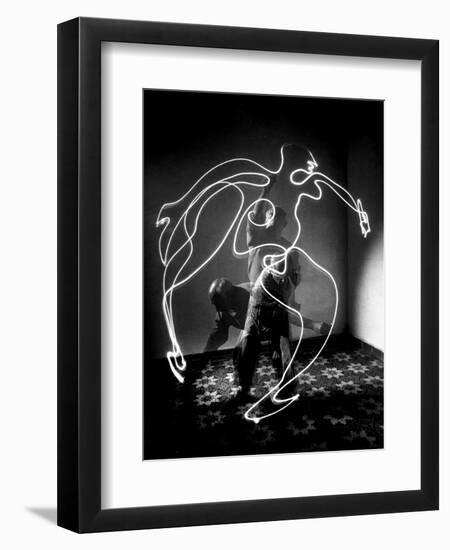 Multiple Exposure of Artist Pablo Picasso Using Flashlight to Make Light Drawing of a Figure-Gjon Mili-Framed Premium Giclee Print