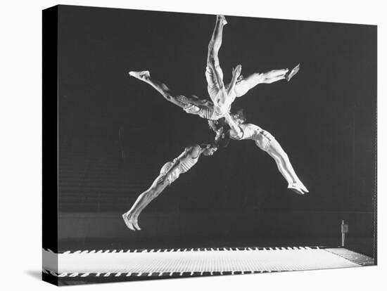 Multiple Exposure Shot of a Gymnast Jumping on a Trampoline-J^ R^ Eyerman-Stretched Canvas