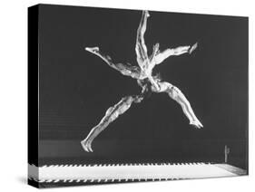 Multiple Exposure Shot of a Gymnast Jumping on a Trampoline-J^ R^ Eyerman-Stretched Canvas