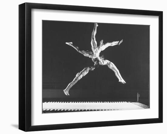 Multiple Exposure Shot of a Gymnast Jumping on a Trampoline-J^ R^ Eyerman-Framed Photographic Print