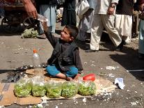 Afghan Child 5, Receives a Bottle of Water-Musadeq Sadeq-Framed Photographic Print