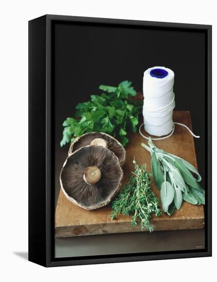 Mushrooms, Fresh Herbs & Kitchen String on Chopping Board-Michael Paul-Framed Stretched Canvas