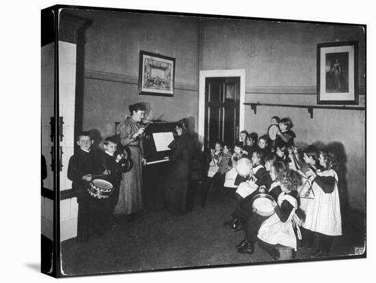 Music Lesson at a German School. One Teacher Plays the Piano-null-Stretched Canvas