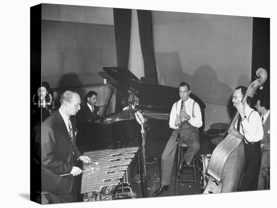 Musician Benny Goodman Playing the Clarinet While Making a Record-null-Stretched Canvas